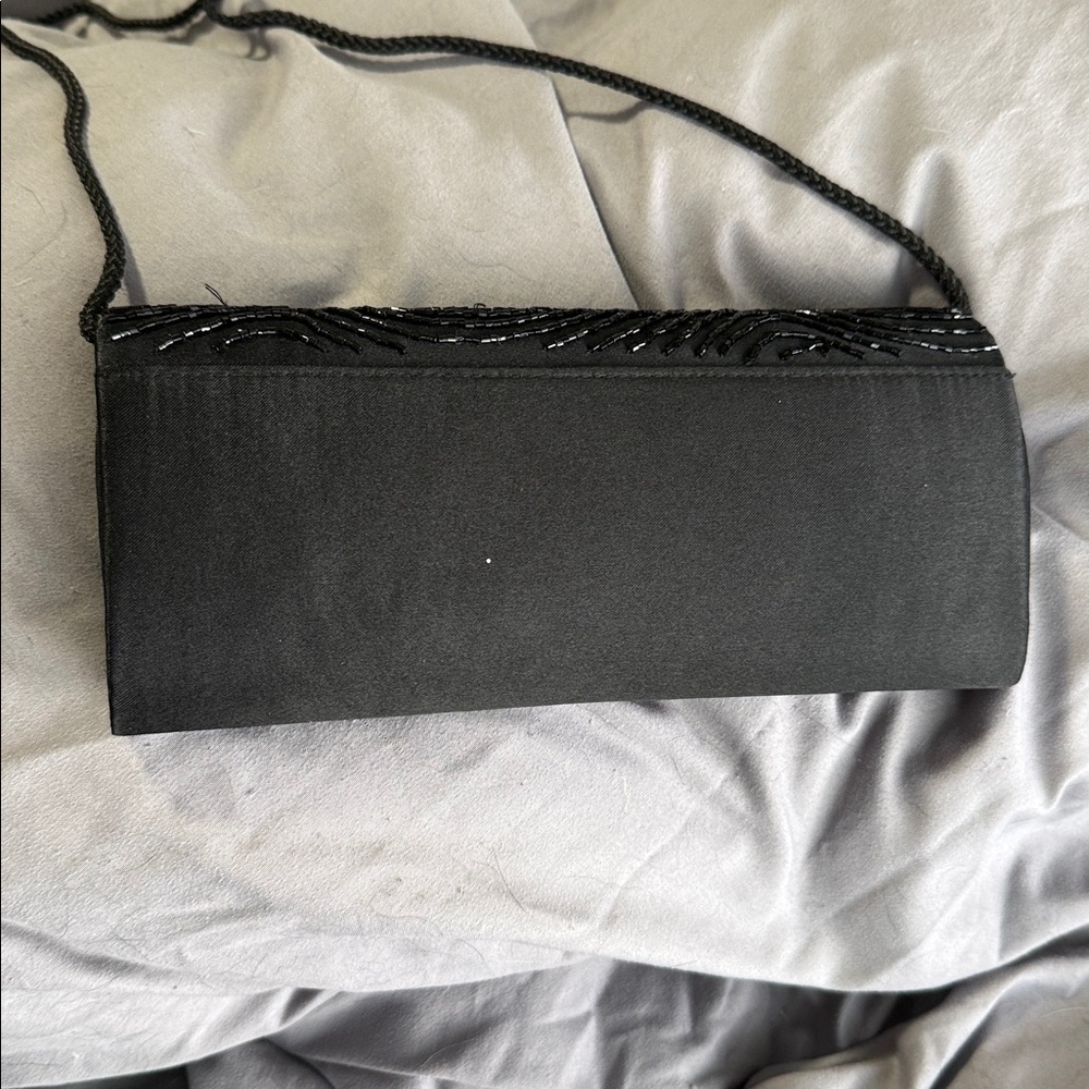 Elegant Black Beaded Evening Clutch
Plus free sheer shoulder wrap. - Picture 10 of 10
